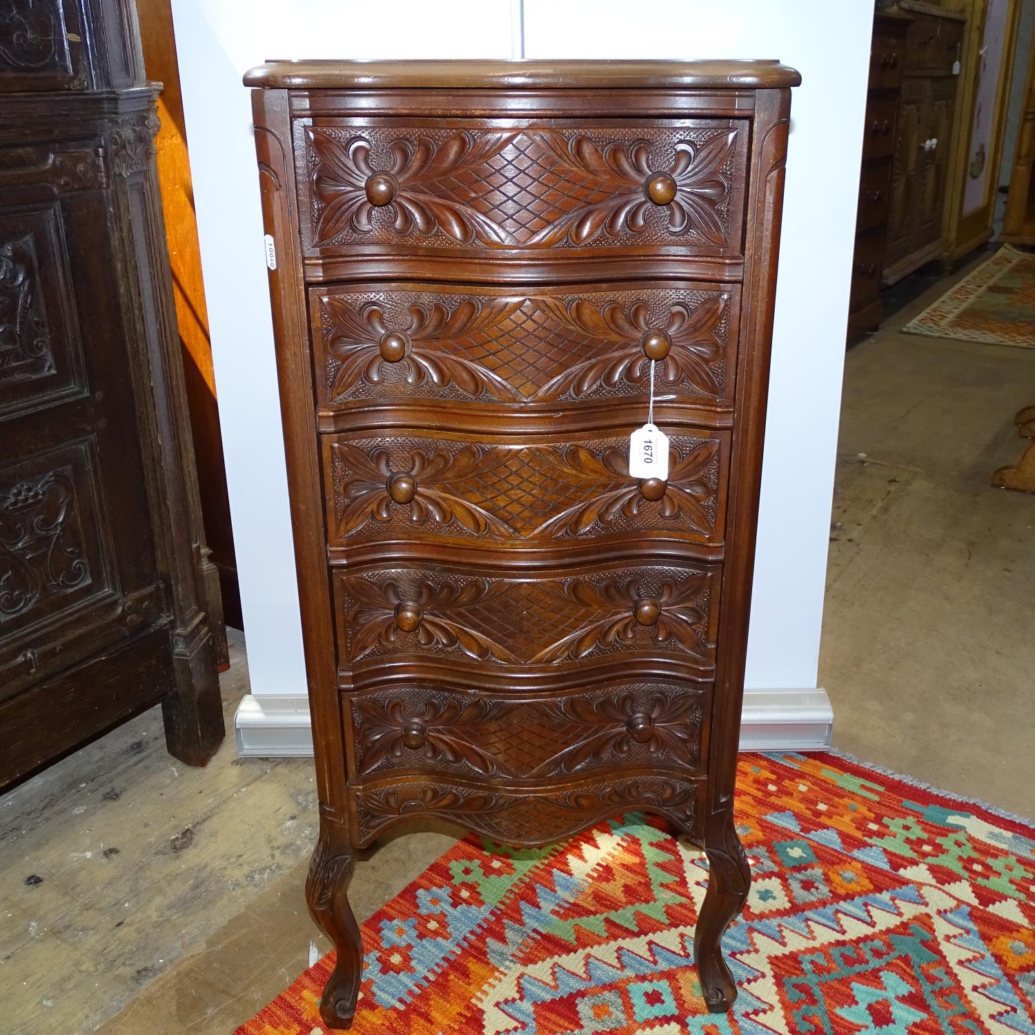A French serpentine-front chest of narrow size, with 5 short carved drawers, W40cm, H90cm, D30cm