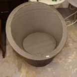 A rattan effect garden tub chair