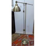 A modern brass effect floor standing library lamp with adjustable arm, H140cm