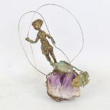 A verdigris bronze sculpture of a child, on natural amethyst geode base, height 16cm