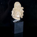 An Ancient carved stone head sculpture, possibly South American, on modern block plinth, overall