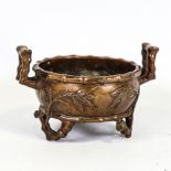 A Chinese patinated bronze 2-handled incense burner, relief moulded bamboo designs, impressed 6
