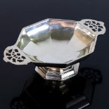 An Art Deco George V octagonal silver sweetmeat dish, with pierced handles, by Walker & Hall,