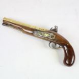 A George II brass-barrelled flintlock coaching pistol, barrel stamped Rimes London, engraved brass