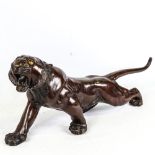 An Meiji period, Japanese, patinated bronze tiger, with makers stamp to underside, length 65cm