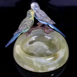 A circular onyx bowl surmounted by cold painted bronze budgies, bowl diameter 11cm, together with