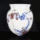 A Chinese blue and white porcelain wall vase, with iron red decoration and seal mark, height 12cm