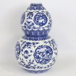 A Chinese blue and white porcelain double-gourd vase, painted decoration, 6 character seal mark,
