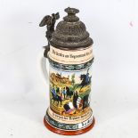 A 19th century German porcelain stein, cast-pewter lid with hand painted battle scenes and