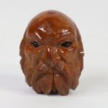 An 18th century coquilla nut snuffbox, in the form of a bearded man's head with glass eyes, length
