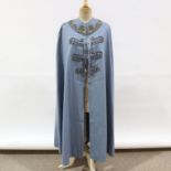 A 1950s opera cloak with gold braid collar