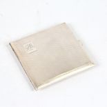 An Art Deco George VI silver cigarette case, allover engine turned decoration with gilt interior,