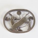 GEORG JENSEN - a Vintage Danish 'Kneeling Deer' brooch, designed by Arno Malinowski, openwork