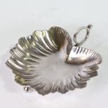 A Victorian silver leaf-shaped nut dish, on 3 bun feet with ring handle, by Mappin & Webb, hallmarks