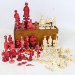 A collection of 19th century red and white stained ivory chessmen From various sets and many