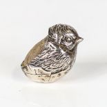SAMPSON MORDAN & CO - an Edwardian novelty silver figural chick pin cushion, hallmarks Chester 1909,