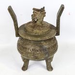 A Chinese soapstone incense burner with dragon knop, on 3 carved feet, height 26cm