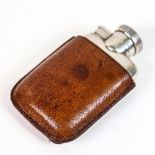 A small George V silver pocket hip flask, with fitted leather sleeve, by J C Vickery, hallmarks