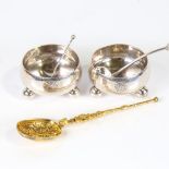 A pair of Victorian silver salt cellars on bun feet, a silver-gilt anointing spoon, and 2 cruet
