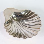 An Edwardian silver shell-shaped butter dish, by Mappin & Webb, hallmarks Sheffield 1908, length