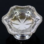 An Edwardian silver pedestal bon bon dish, gadrooned rim with pierced border, by Charles