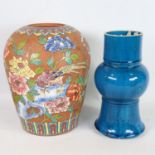 A Chinese terracotta vase, with painted enamel birds and flowers, height 28cm, and a blue glaze