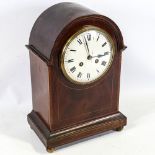 An Edwardian mahogany-cased 8-day dome-top mantel clock, white enamel dial with Roman numeral hour