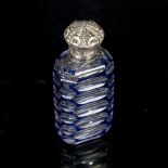 A small blue overlay cut-glass perfume bottle, with unmarked white metal top, height 7cm