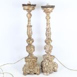 A pair of 18th century carved gilt-wood candle stands, height 60cm