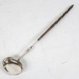 A Georgian silver toddy ladle, with twisted whale baleen handle, length 37cm Bowl has 1 small