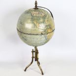 A tinplate and brass desk globe, height 36cm, diameter approx 16cm