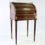 An unusual 19th century French mahogany and brass-mounted cylinder-front side cabinet of small size,