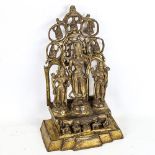 A Chinese gilt-bronze shrine, with 3 standing figures, height 28cm