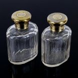 ASPREY - a pair of George V silver-mounted glass dressing table perfume bottles, silver-gilt