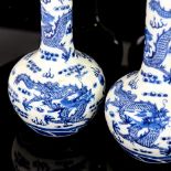 A pair of Chinese blue and white porcelain narrow-necked dragon vases, 4 character marks, height