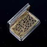 A Victorian silver vinaigrette, rectangular form with allover engine turned decoration, gilt