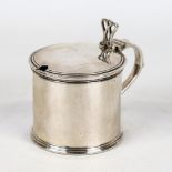 An Elizabeth II silver drum-shaped mustard pot, cylindrical form with blue glass liner and raised