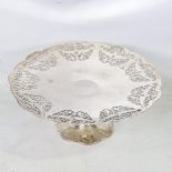 A George V silver pedestal cake stand, pierced Adams style and foliate decoration, by Charles S