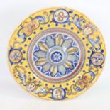 19th century French/Italian faience pottery charger, raised central boss with raised beaded surround
