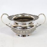 A late Victorian heavy gauge silver 2-handled sugar bowl, half-fluted decoration with cast foliate