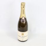 A bottle of Charles Heidsieck Extra Dry Champagne, vintage 1964 Some stains to labels, capsule