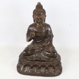 A Chinese patinated bronze seated Buddha, height 36cm