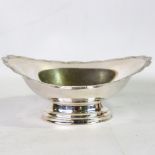 An Elizabeth II oval silver pedestal bon bon dish, bright-cut engraved floral decoration, by Barker,
