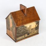 A mahogany cottage-shaped moneybox, with printed rural scenes, length 14.5cm