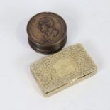 A 19th century engraved brass snuffbox dated 1853, length 7cm, and a circular snuffbox with