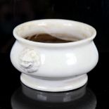 A Chinese white glaze porcelain miniature jardiniere, raised lion mask handles, rim diameter 12.5cm