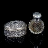 A small Edwardian oval embossed silver box, Birmingham 1902, length 5cm, and a small cut-glass
