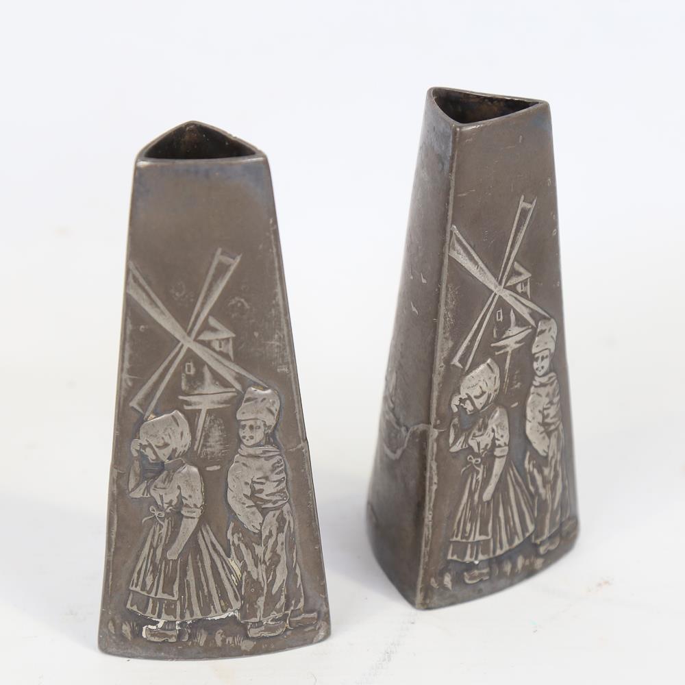 WMF - pair of plated spill vases of tapered triangular form, with relief moulded designs of Dutch