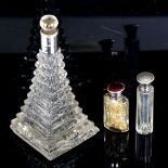 A step-cut glass perfume bottle with silver collar, height 15cm, and a small silver and enamel-