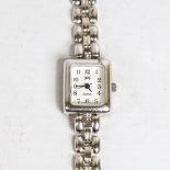A modern lady's sterling silver quartz bracelet watch, white dial with Arabic numerals and silver